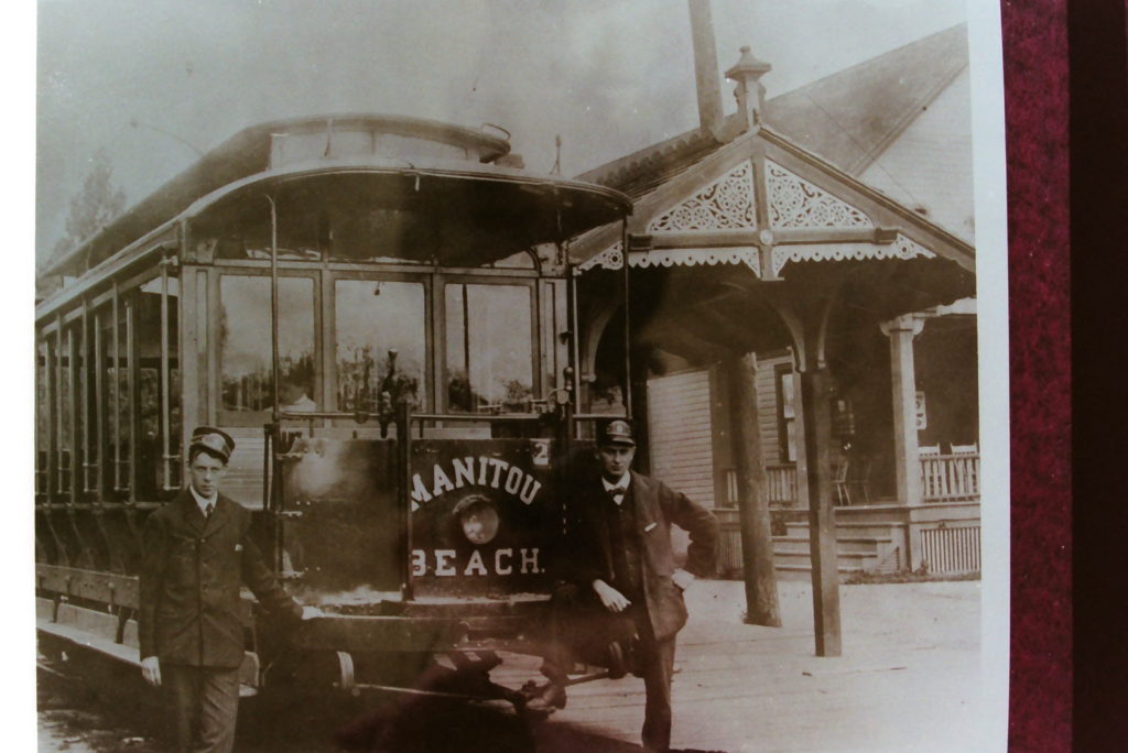 Conductors in Front of Manitou Beach Trolley