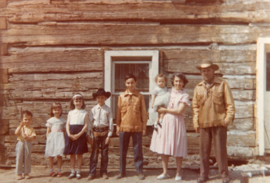 Family Photo Outside Island Cottage Home